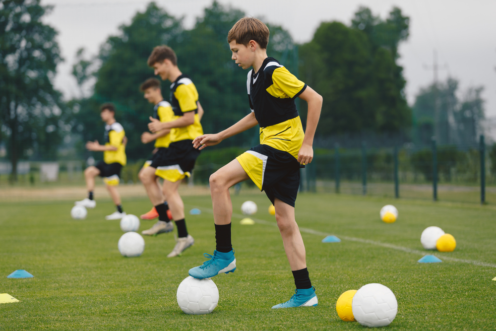 Teenage,Boys,Training,Sports,In,A,Row.,Soccer,Summer,Camp