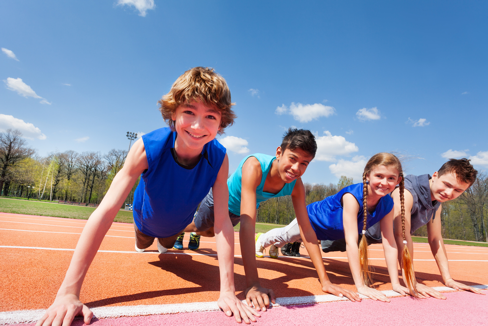 Happy,Teenagers,Holding,Plank,Outdoor,On,The,Track